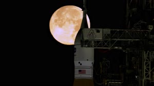 Full Moon Rising Over Full Artemis II Stack at Launch Pad 39B